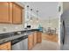Kitchen sink in the foreground looking into the living room area with open floor plan at 1984 Folly Rd # A306, Charleston, SC 29412