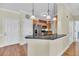Open kitchen design featuring stainless steel appliances, granite countertops, and a breakfast bar at 1984 Folly Rd # A306, Charleston, SC 29412