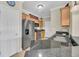 Kitchen featuring stainless steel appliances, tan cabinets, and granite counter tops at 1984 Folly Rd # A306, Charleston, SC 29412