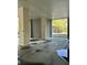 Covered parking area with concrete pillars and water puddles on the ground at 1984 Folly Rd # A306, Charleston, SC 29412
