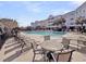 Community pool area with lounge chairs and tables in front of a building at 1984 Folly Rd # A306, Charleston, SC 29412