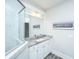 This bathroom features a granite countertop, a decorative mirror, and a tile shower with a glass partition at 2010 Redback Dr, Summerville, SC 29483