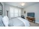 The neutral tone bedroom has a bed, a ceiling fan, a table and a television at 2010 Redback Dr, Summerville, SC 29483