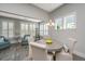 Bright dining area with large windows and modern decor at 2010 Redback Dr, Summerville, SC 29483