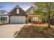 Beautiful exterior view of a home with stone accents, a front porch, and a two-car garage at 2010 Redback Dr, Summerville, SC 29483