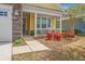 Charming home with stone accents, a two-car garage, and a cozy front porch with landscaping at 2010 Redback Dr, Summerville, SC 29483
