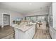 Open concept kitchen with granite countertop, stainless steel appliances, and views of the living area at 2010 Redback Dr, Summerville, SC 29483