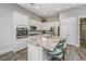 Bright kitchen with granite countertop island, modern appliances, and ample storage space at 2010 Redback Dr, Summerville, SC 29483