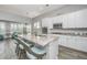 Open-concept kitchen and living room featuring a spacious island and modern stainless-steel appliances at 2010 Redback Dr, Summerville, SC 29483