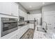 Well-equipped kitchen with granite counters, stainless steel appliances, and ample white cabinetry at 2010 Redback Dr, Summerville, SC 29483