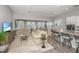 Open-concept living space with hardwood floors, shutters, comfortable furniture and lots of natural light at 2010 Redback Dr, Summerville, SC 29483