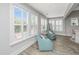 Bright living room with plantation shutters and comfortable seating at 2010 Redback Dr, Summerville, SC 29483