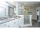 Beautiful main bathroom with a tile shower, granite counters, and double sinks at 2010 Redback Dr, Summerville, SC 29483