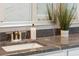 Close up of the bathroom sink, granite counter, and bronze faucet at 2036 Yaupon Way, Johns Island, SC 29455