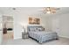 Bright bedroom with a gray bed frame, striped bedding, and a ceiling fan at 2036 Yaupon Way, Johns Island, SC 29455