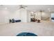This large bonus room has two ceiling fans, neutral carpet, and a leather futon at 2036 Yaupon Way, Johns Island, SC 29455