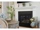 Living room fireplace featuring a decorative mantel and nautical decor at 2036 Yaupon Way, Johns Island, SC 29455