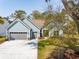 Charming front exterior of home featuring a three car garage and inviting entrance at 2036 Yaupon Way, Johns Island, SC 29455