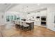 Stylish kitchen with white cabinetry, a gray island with seating, and stainless steel appliances at 2036 Yaupon Way, Johns Island, SC 29455