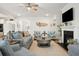 Living room with ceiling fan, fireplace, and other gathering space at 2036 Yaupon Way, Johns Island, SC 29455