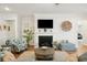 Cozy living room with fireplace, large TV, and stylish decor at 2036 Yaupon Way, Johns Island, SC 29455