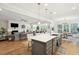 Open floor plan with kitchen, dining area, and living room, perfect for entertaining at 2036 Yaupon Way, Johns Island, SC 29455