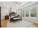 Spacious main bedroom with wood floors, tray ceiling, ceiling fan, and a large window at 2036 Yaupon Way, Johns Island, SC 29455