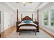 Large main bedroom with a four poster bed and wood flooring at 2036 Yaupon Way, Johns Island, SC 29455