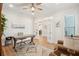 Comfortable office with a desk, chair, an area rug, and glass French doors at 2036 Yaupon Way, Johns Island, SC 29455