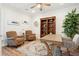 Cozy home office featuring a wooden desk, decorative rug, and built-in bookcase at 2036 Yaupon Way, Johns Island, SC 29455