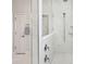 Shower with marble tiles and a shower head at 2036 Yaupon Way, Johns Island, SC 29455
