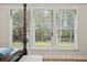A window with a view of the trees and backyard at 2036 Yaupon Way, Johns Island, SC 29455