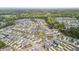 Expansive aerial view of the neighborhood with ponds, verdant trees and diverse housing options at 204 Corvus St, Summerville, SC 29483