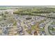 Aerial view featuring an expansive neighborhood with a pond and vibrant green surroundings at 204 Corvus St, Summerville, SC 29483