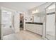 Spacious bathroom featuring tile flooring, double sink, and a glass enclosed shower at 204 Corvus St, Summerville, SC 29483