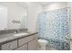 Bathroom featuring a granite countertop vanity, mirror, toilet, and a polka dot shower curtain at 204 Corvus St, Summerville, SC 29483