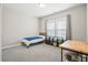 Bedroom with light gray walls, carpeted floor, a bed, and a window with blinds at 204 Corvus St, Summerville, SC 29483