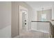 Hallway with light gray carpet and paint, as well as natural lighting at 204 Corvus St, Summerville, SC 29483