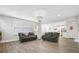Spacious living room with hardwood floors, comfortable seating, and open floor plan to kitchen at 204 Corvus St, Summerville, SC 29483