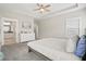 Bright main bedroom features tray ceiling, ensuite access, and neutral color palette at 204 Corvus St, Summerville, SC 29483