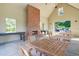 Interior view of a community pavilion featuring a brick fireplace, picnic tables, and ample seating at 204 Corvus St, Summerville, SC 29483