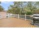 Relaxing back deck with a grill and white railing, providing ample space for outdoor gatherings at 2093 Rookery Ln, Charleston, SC 29414