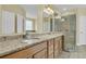 This bathroom features granite counters, double vanity, glass enclosed shower and tile floors at 2093 Rookery Ln, Charleston, SC 29414
