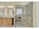 This bathroom features a glass enclosed shower with seat and safety bar, granite counters, and tile floors at 2093 Rookery Ln, Charleston, SC 29414
