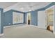 Bedroom featuring neutral carpet, shuttered windows and ensuite bathroom at 2093 Rookery Ln, Charleston, SC 29414