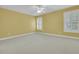 Bedroom with neutral carpet, ceiling fan and shuttered windows at 2093 Rookery Ln, Charleston, SC 29414