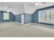 Carpeted bedroom boasts vaulted ceiling, ceiling fans, and shuttered windows at 2093 Rookery Ln, Charleston, SC 29414