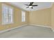 Bedroom with neutral carpet, ceiling fan and shuttered windows at 2093 Rookery Ln, Charleston, SC 29414