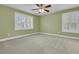 Bright, airy bedroom boasts shuttered windows and neutral carpeting at 2093 Rookery Ln, Charleston, SC 29414