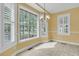 Cheerful breakfast nook with large windows offering scenic views of the surrounding landscape at 2093 Rookery Ln, Charleston, SC 29414
